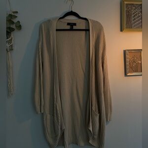 Cream knit cardigan.